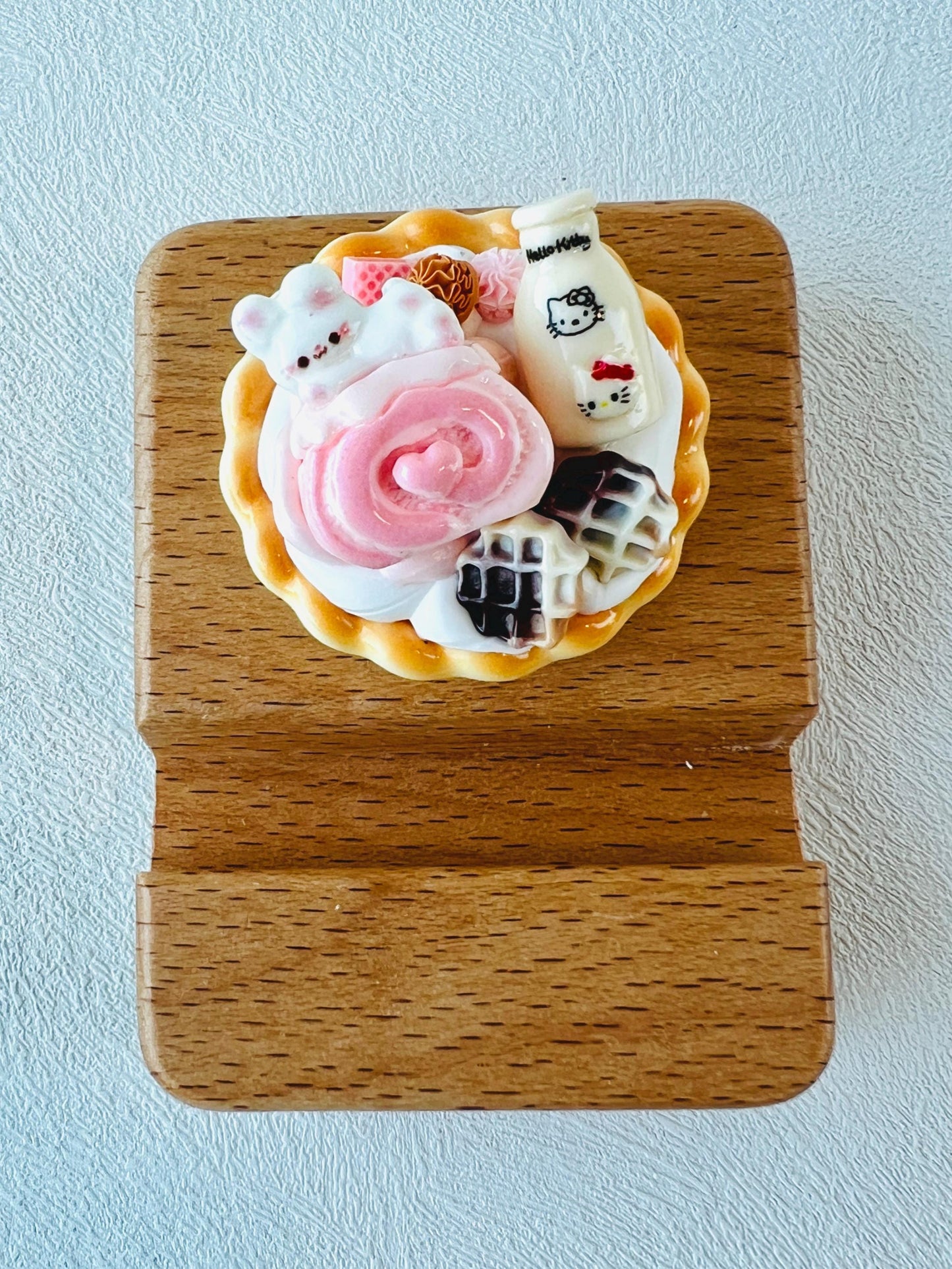 Personalized wooden phone stand with cute theme engraving