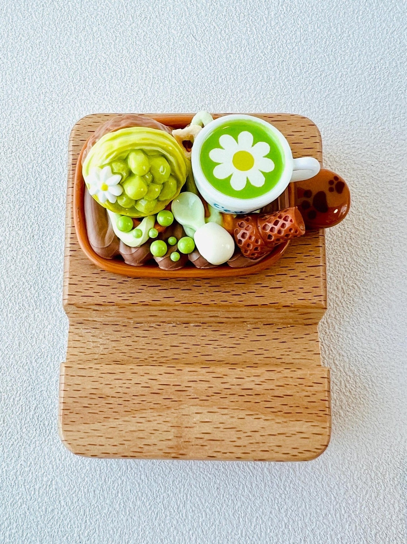 Personalized wooden phone stand with cute dessert design