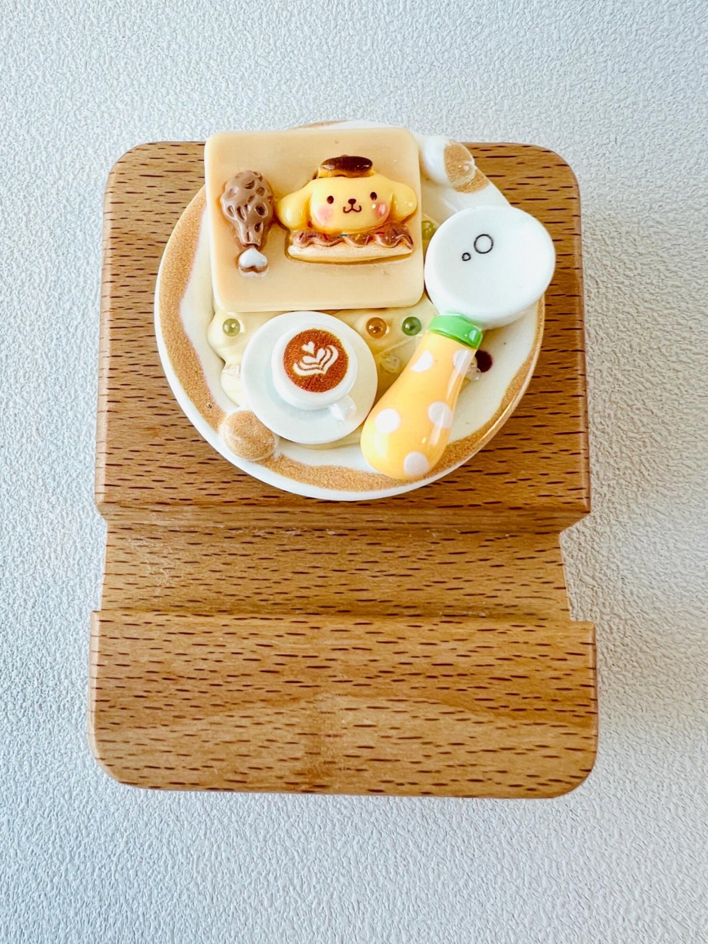 Personalized wooden phone stand with cute character theme engraving