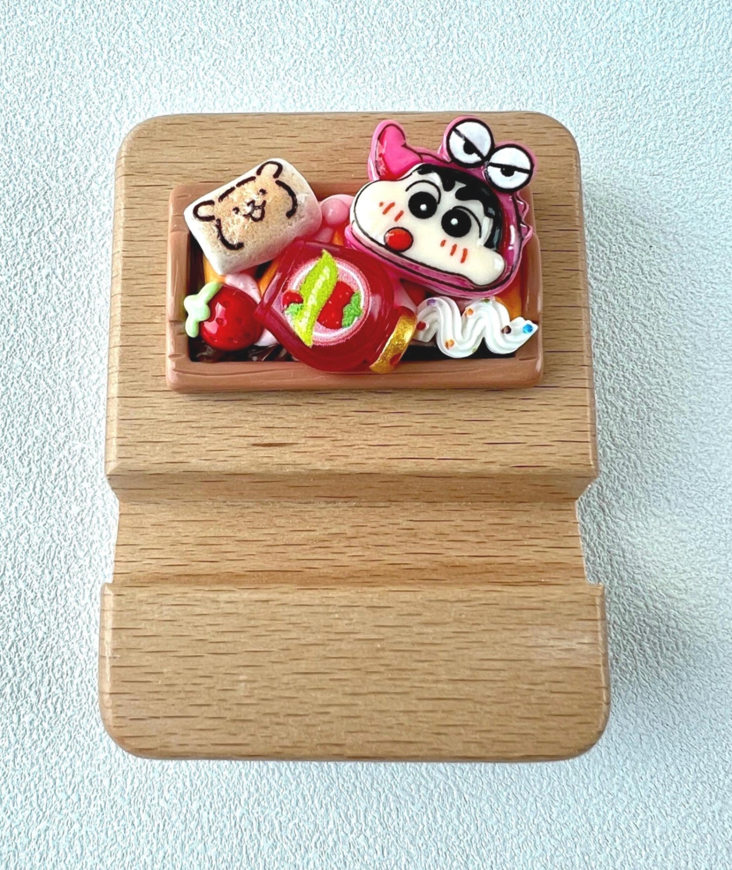 Personalized wooden phone stand with cute crayon shin chan theme engraving