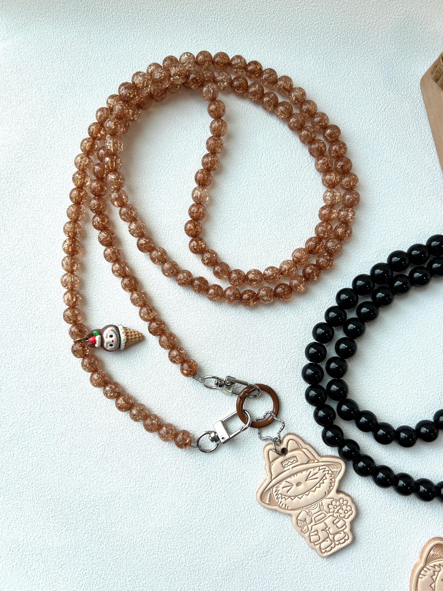 crossbody beaded phone chain with a leather labubu charm