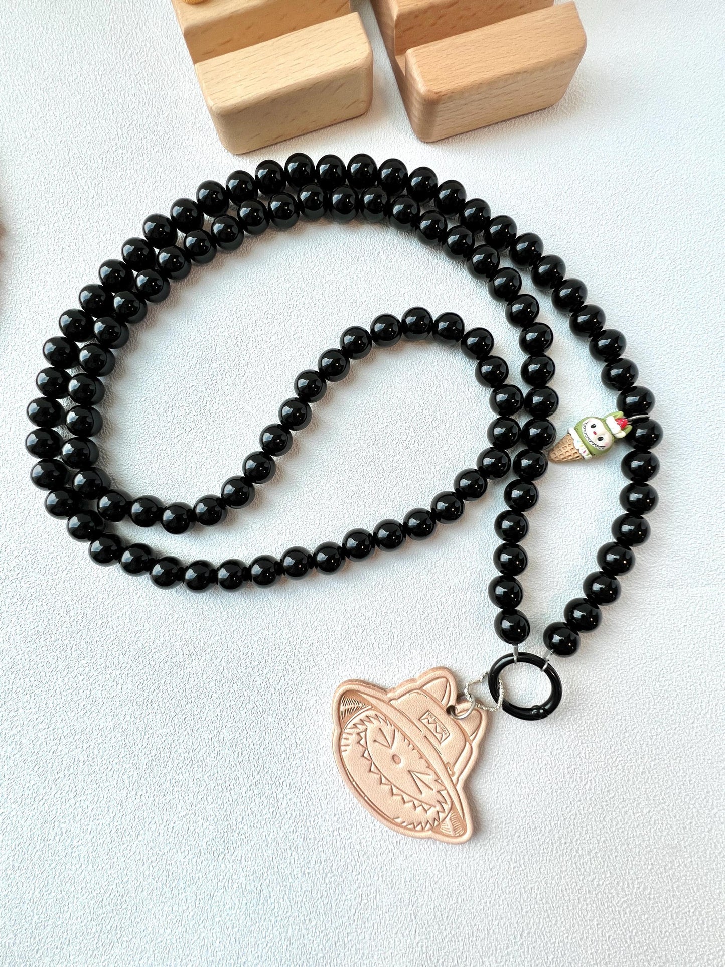 crossbody beaded phone chain with a leather labubu charm