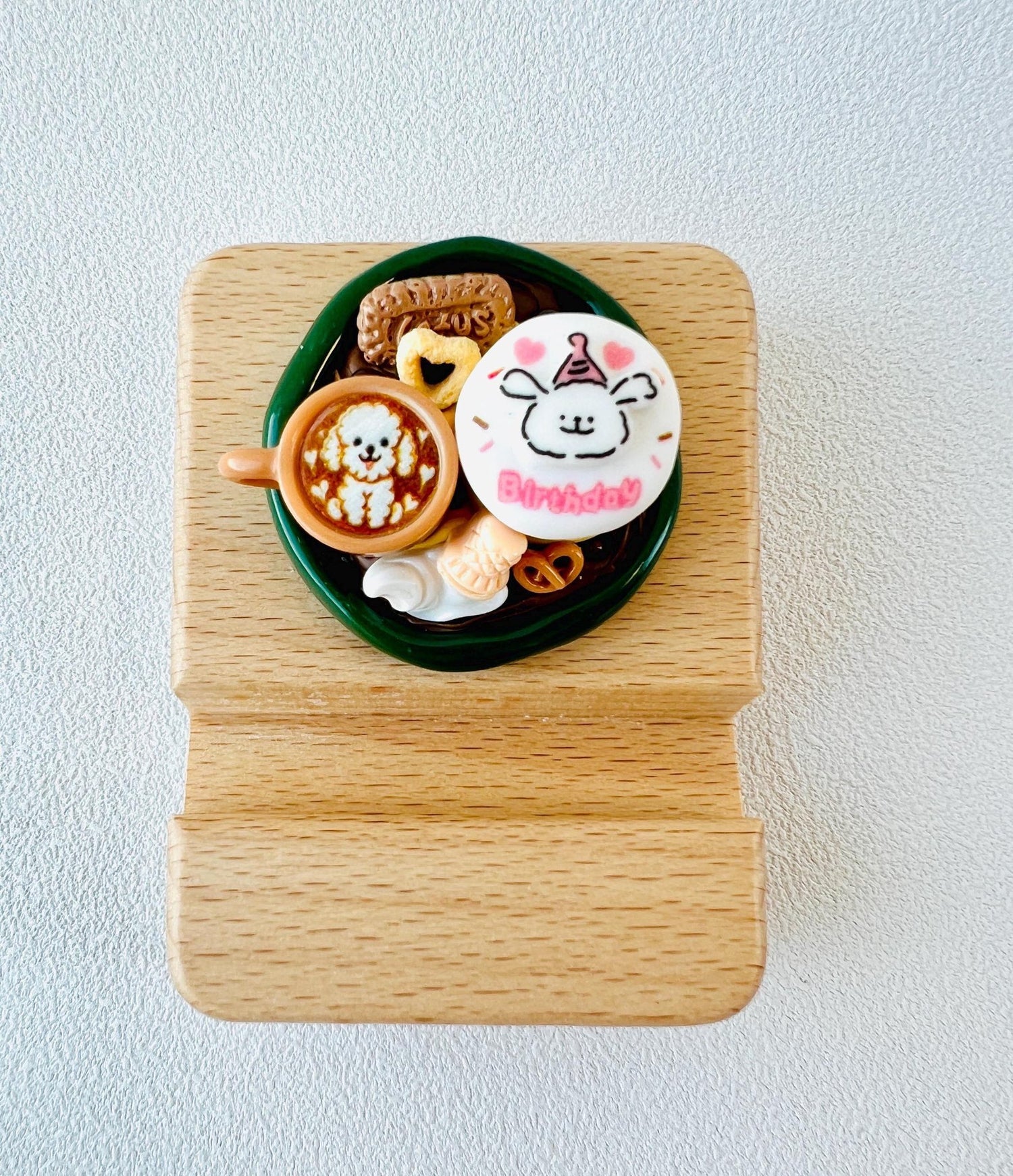 Personalized wooden phone stand with cute birthday cake design