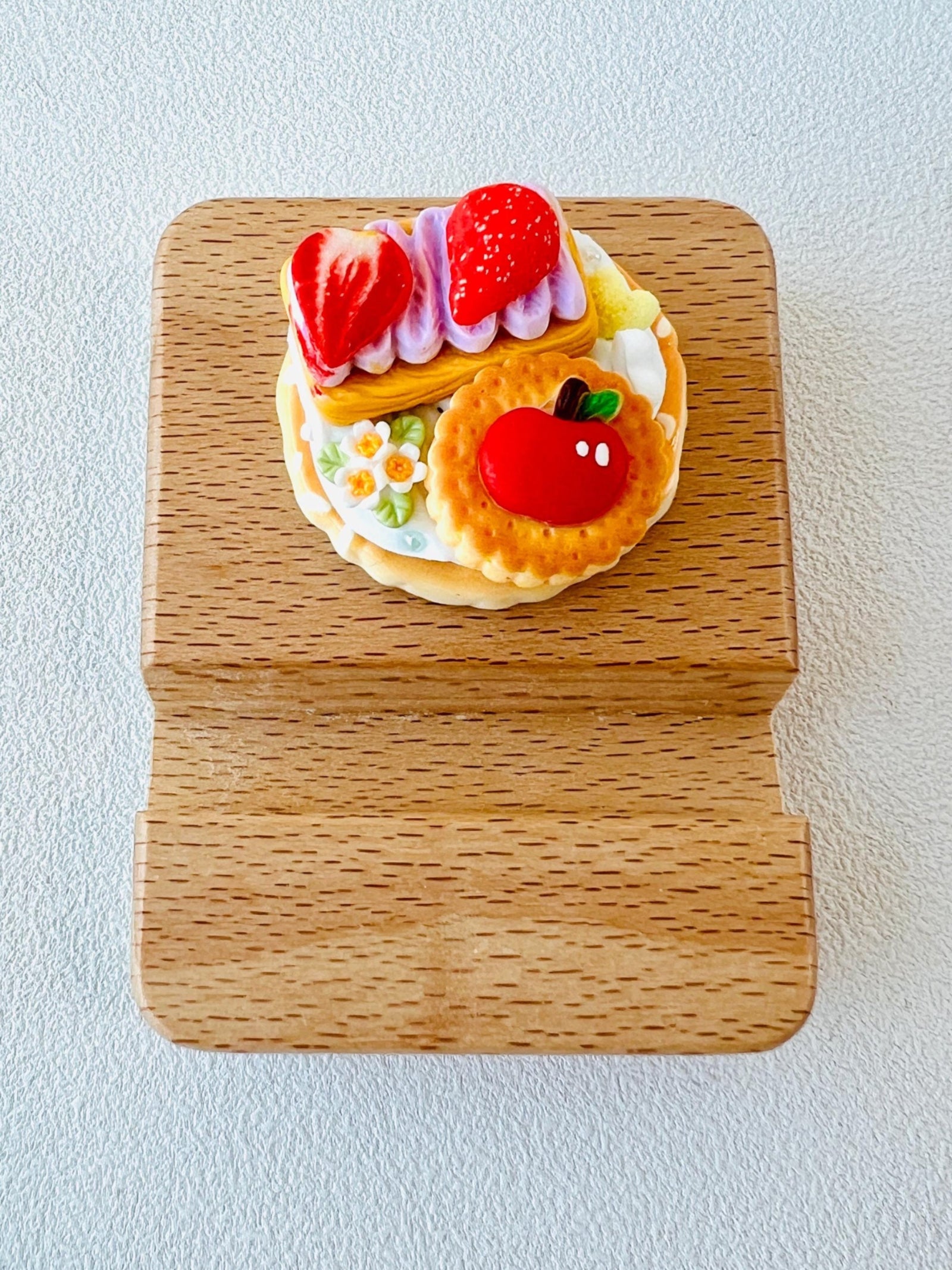 Personalized wooden phone stand with cute dessert theme engraving