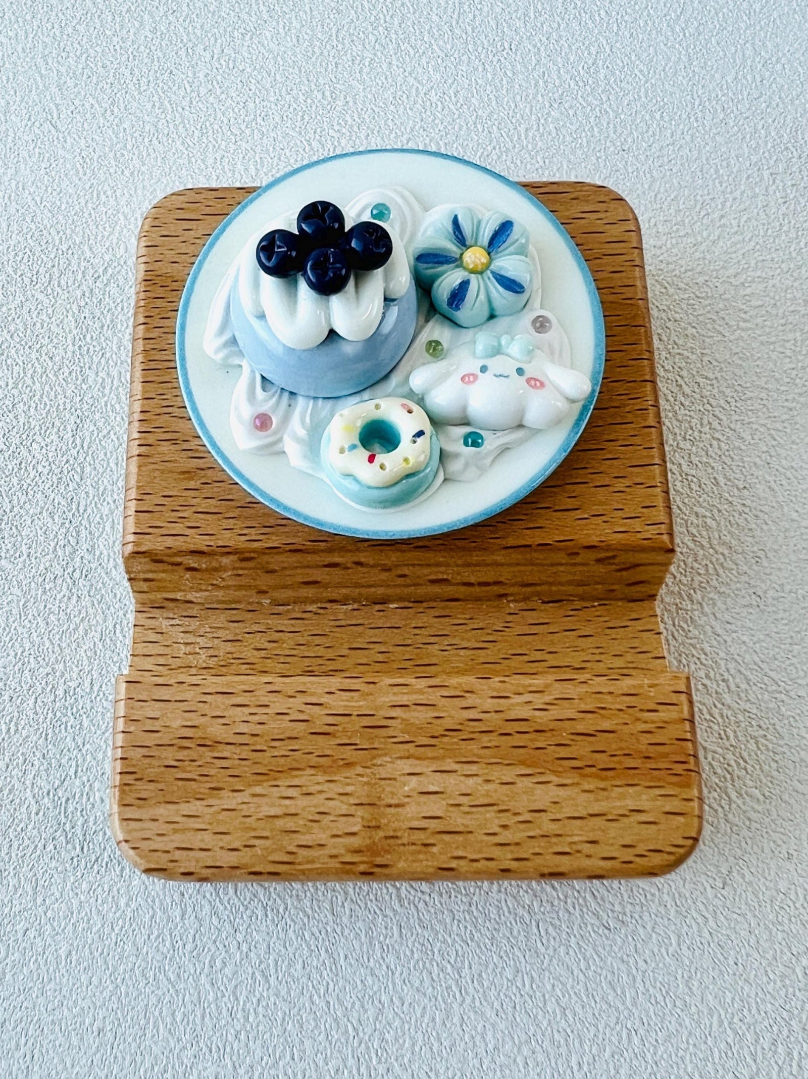 Personalized wooden phone stand with cute dessert theme engraving